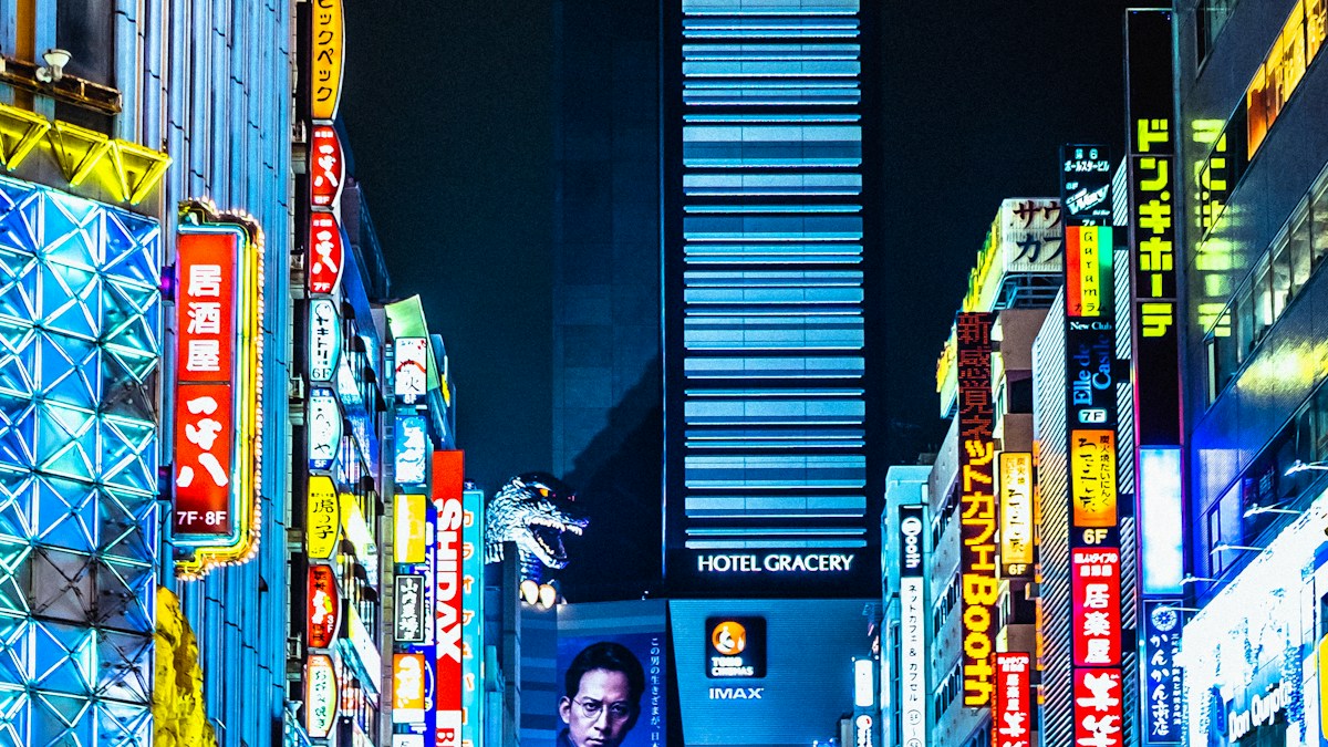 Bank of Japan headquarters in Tokyo with Japanese Yen financial ticker board